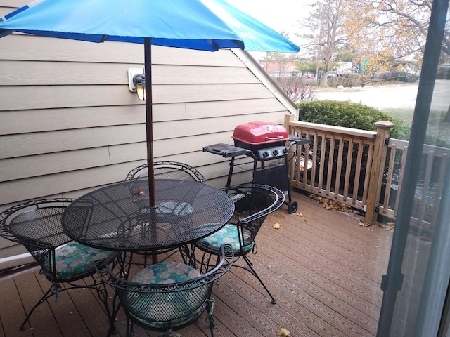 wooden deck featuring grilling area