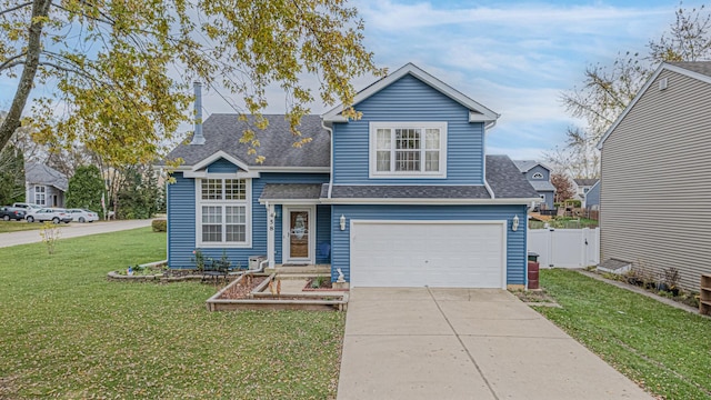 view of front facade with a front yard and a garage