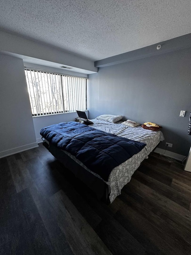 bedroom featuring a textured ceiling