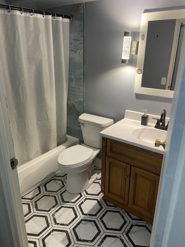 full bathroom with vanity, shower / bath combination with curtain, and toilet