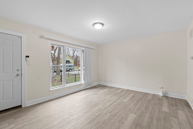 unfurnished room featuring light hardwood / wood-style flooring