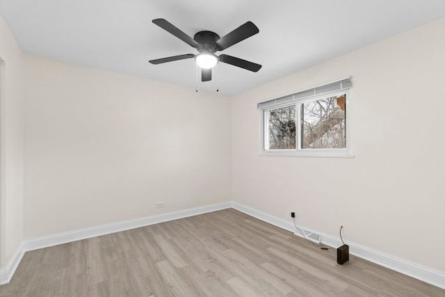 spare room featuring ceiling fan and light hardwood / wood-style floors