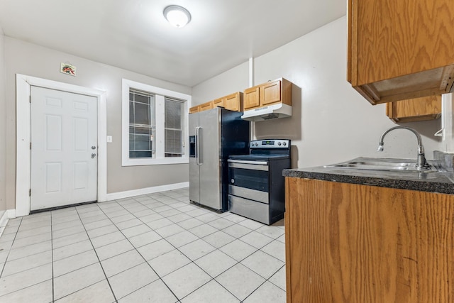 kitchen with sink, light tile patterned floors, and appliances with stainless steel finishes