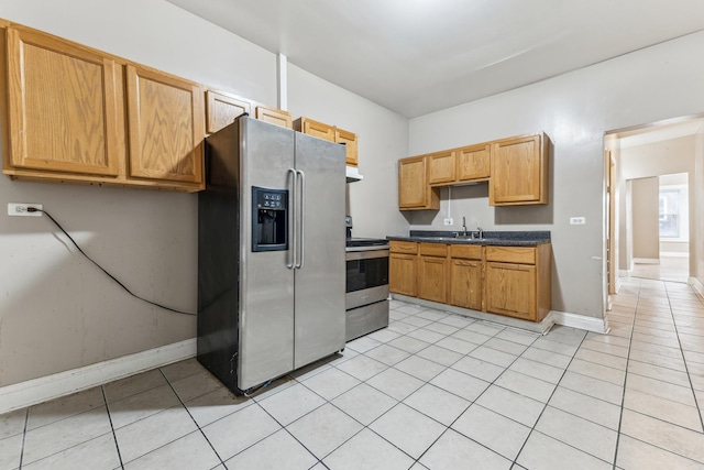 kitchen with sink, stainless steel appliances, and range hood