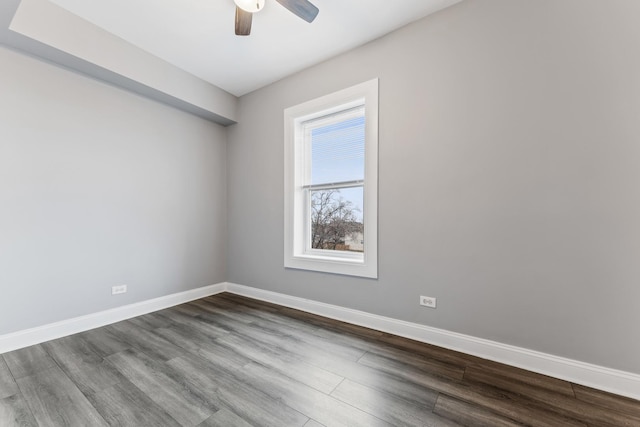 empty room with ceiling fan and wood-type flooring