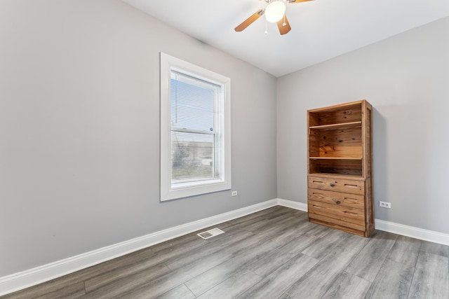 unfurnished room with ceiling fan and light hardwood / wood-style floors