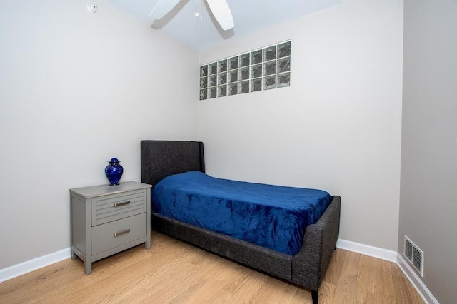 bedroom featuring light hardwood / wood-style flooring and ceiling fan