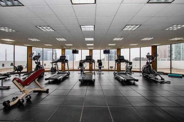 gym with a paneled ceiling