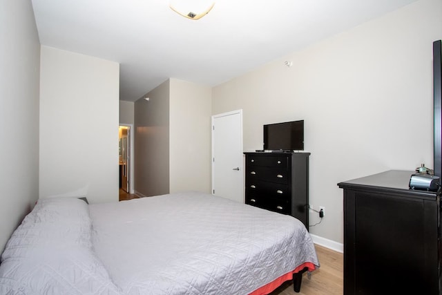 bedroom with wood-type flooring