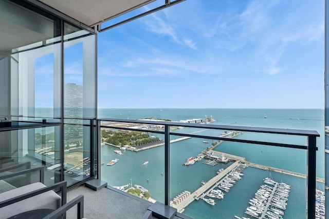 balcony featuring a water view