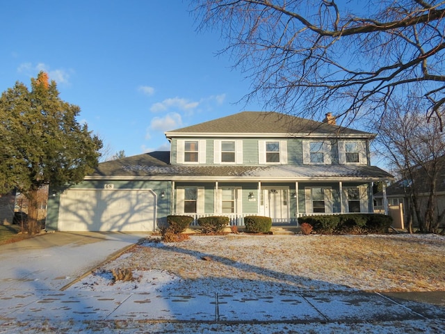 view of front of property featuring a porch and a garage