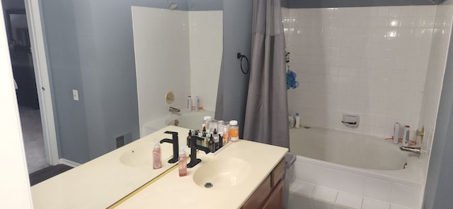 bathroom featuring vanity and shower / bath combo with shower curtain