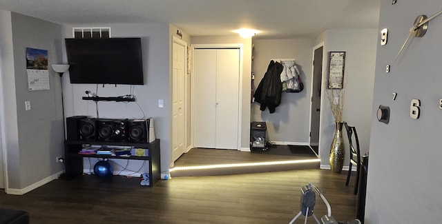 interior space with dark hardwood / wood-style flooring