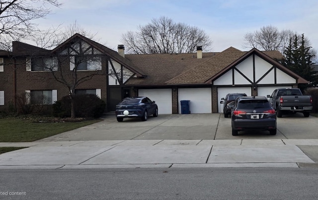 english style home with a garage