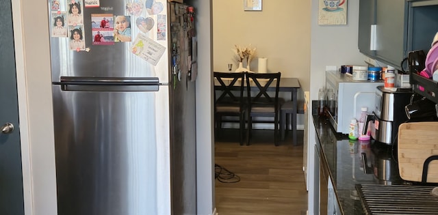 kitchen featuring hardwood / wood-style floors and stainless steel fridge