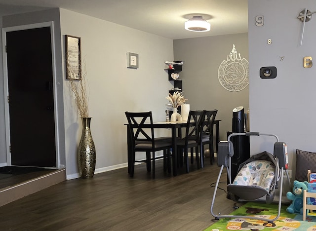 dining space featuring dark hardwood / wood-style floors