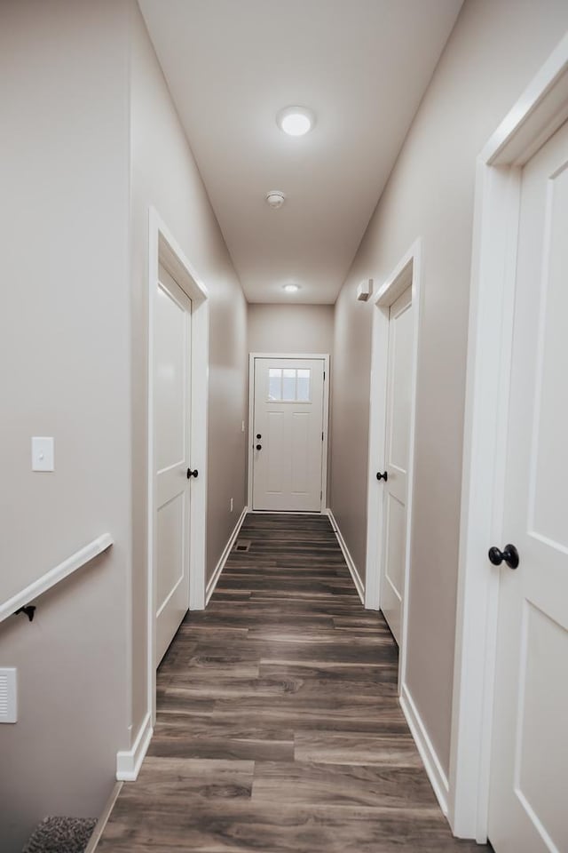 hallway featuring dark hardwood / wood-style floors