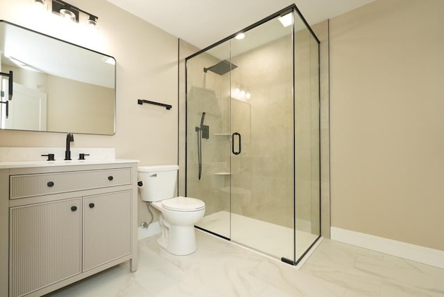 bathroom featuring vanity, an enclosed shower, and toilet