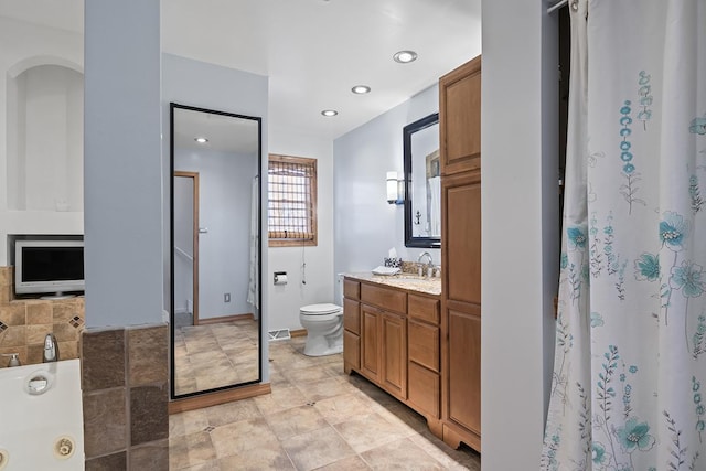 bathroom with vanity and toilet