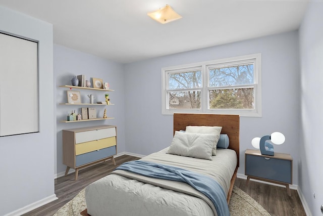 bedroom featuring dark hardwood / wood-style flooring