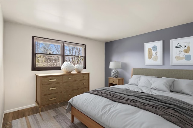 bedroom featuring dark hardwood / wood-style flooring