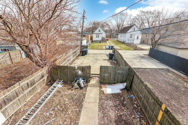 view of yard with a residential view and fence private yard