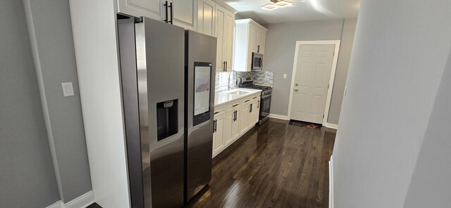 dining room with dark hardwood / wood-style flooring