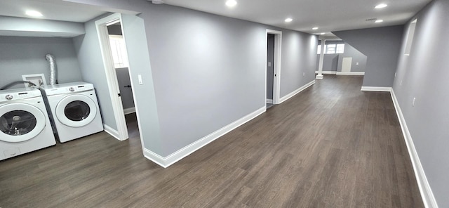 laundry room featuring washer and clothes dryer and dark hardwood / wood-style floors