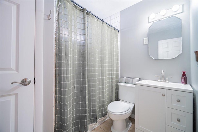 bathroom featuring tile patterned floors, a shower with curtain, vanity, and toilet