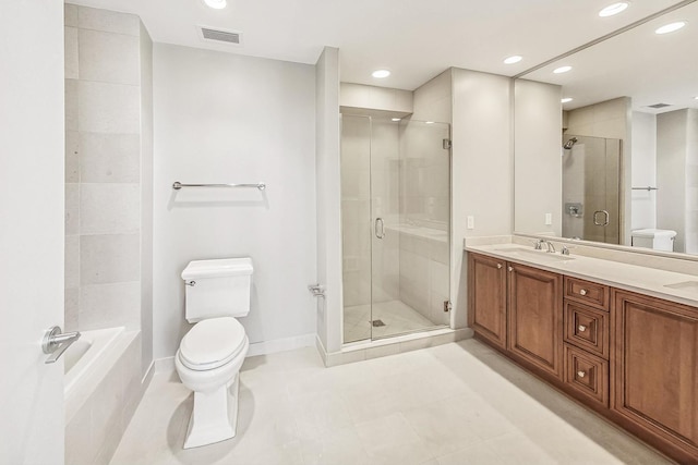 full bathroom featuring toilet, vanity, and separate shower and tub