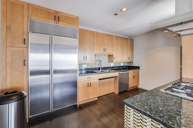 kitchen featuring dark wood-type flooring, sink, decorative backsplash, appliances with stainless steel finishes, and island range hood