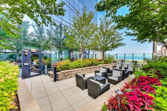 view of patio / terrace with a water view and an outdoor hangout area