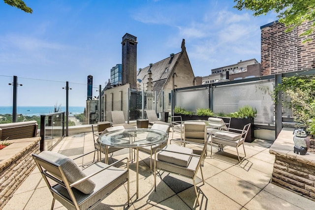 view of patio featuring a water view