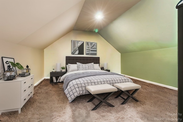 carpeted bedroom with vaulted ceiling