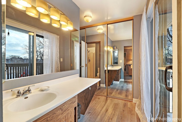 bathroom featuring vanity and hardwood / wood-style flooring