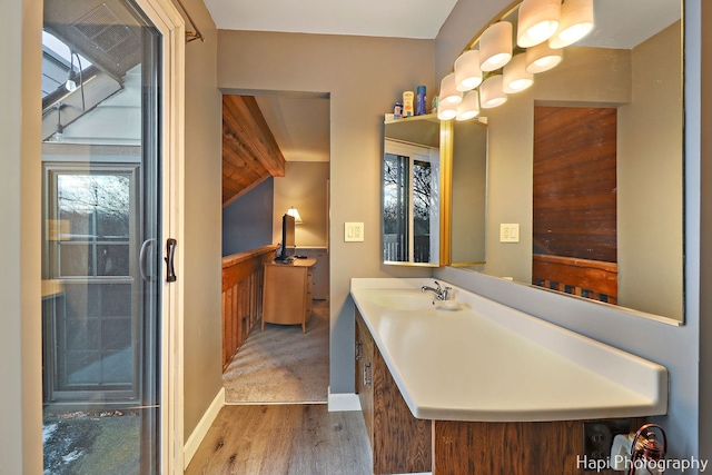 bathroom featuring vanity and hardwood / wood-style flooring