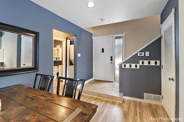 unfurnished dining area with light wood-type flooring