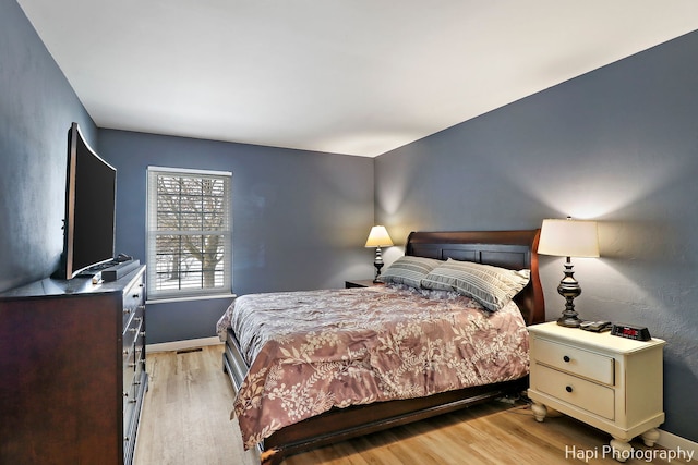 bedroom with light hardwood / wood-style flooring