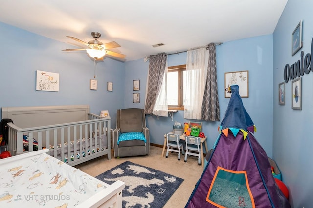 bedroom featuring ceiling fan and carpet