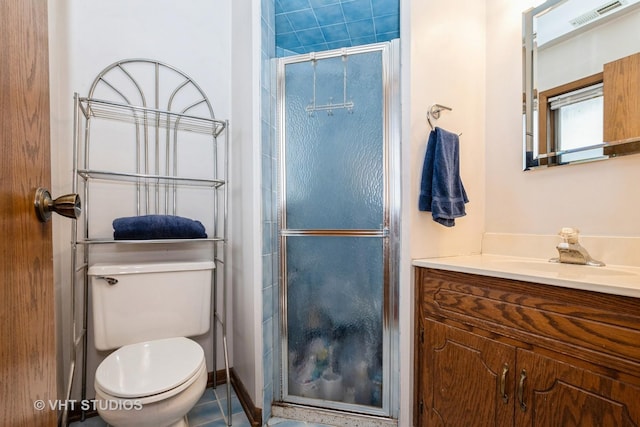 bathroom featuring walk in shower, vanity, and toilet