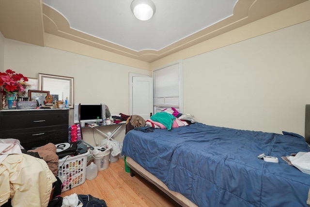 bedroom with hardwood / wood-style flooring