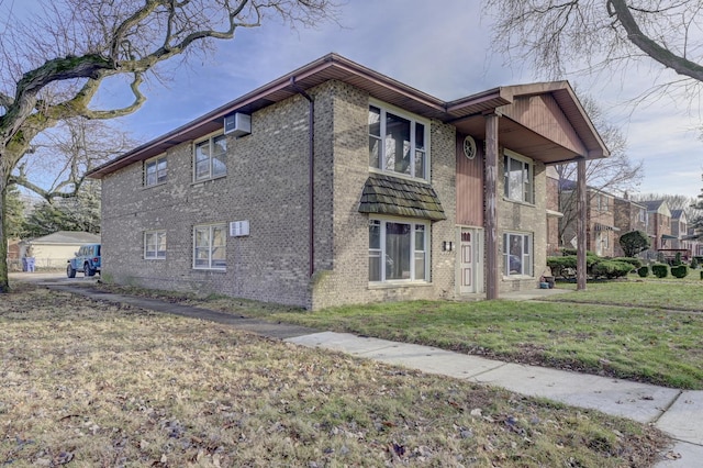 view of side of home with a lawn and a wall unit AC