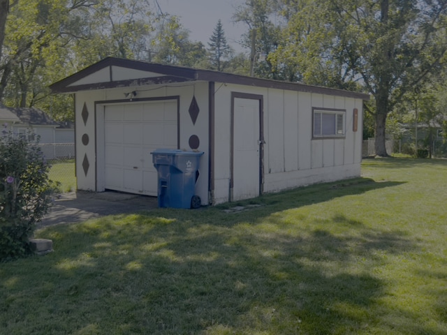 garage with a yard