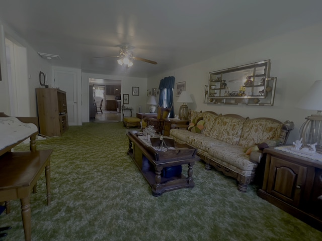 carpeted living room with ceiling fan