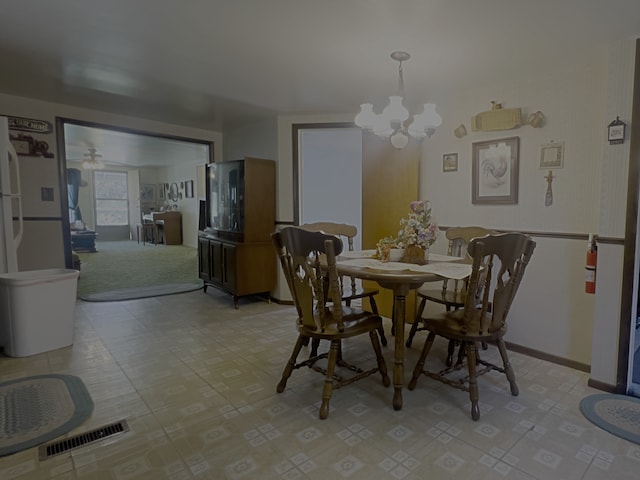 dining area with a chandelier