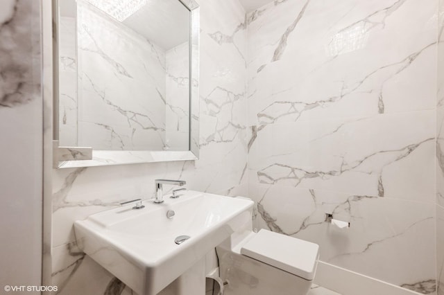 bathroom with sink and toilet