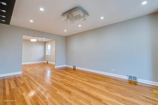 unfurnished room featuring light wood-type flooring