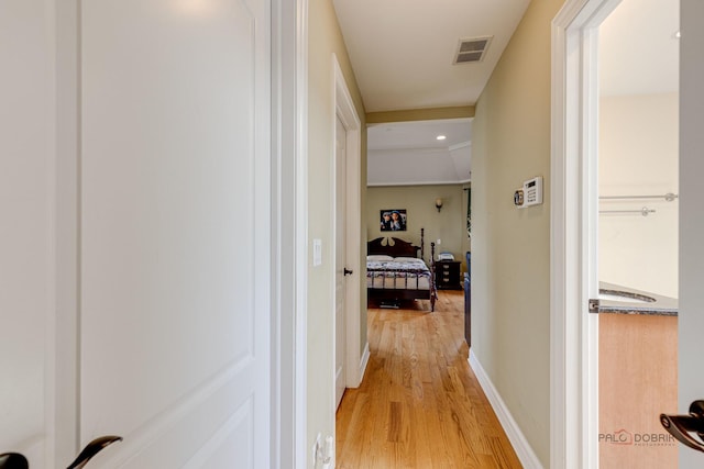 hall with light hardwood / wood-style flooring