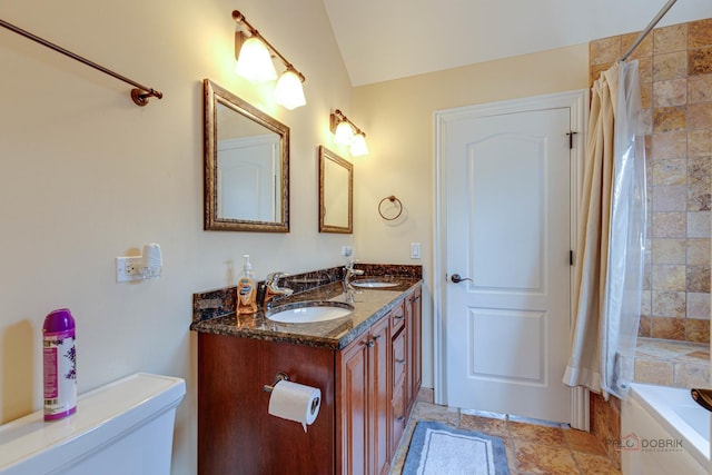 bathroom featuring vanity, vaulted ceiling, and separate shower and tub