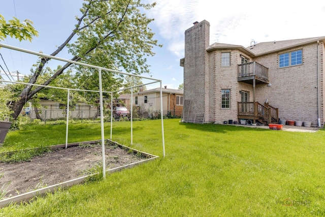 view of yard with a balcony